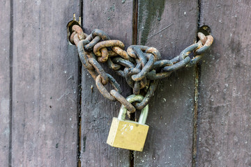 Old wooden door with Chain key lock
