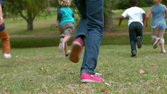 Happy children running at the park