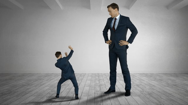 Giant boss yelling on scared businessman