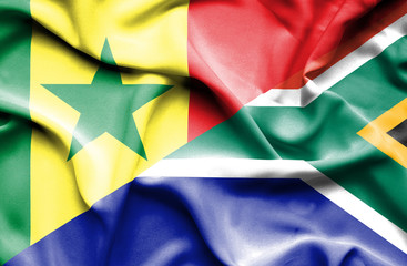 Waving flag of South Africa and Senegal