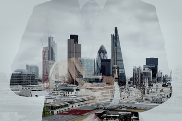 Double exposure of success businessman using smart phone and soc