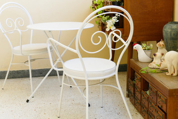 white chair and desk and plant decorating on wooden desk drawer