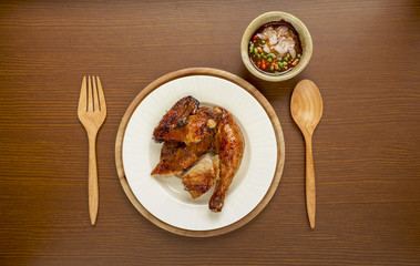 Golden brown grilled chicken with spicy sauce