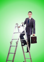 Businessman climbing career ladder against gradient 