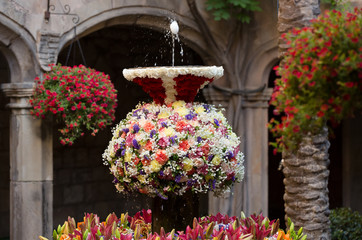 Egg n jet of water in the fountains decorated with flowers