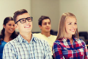 Fototapeta premium group of smiling students in lecture hall