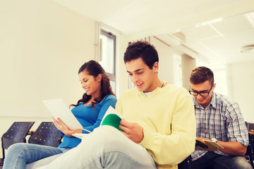 group of smiling students in lecture hall