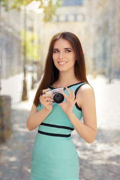 Happy Elegant Woman with Compact Digital Camera