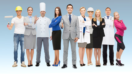 Fototapeta premium happy businessman over professional workers