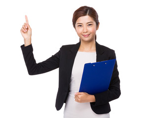 Businesswoman hodling with clipboard and finger point up