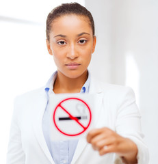 african woman with restriction no smoking sign