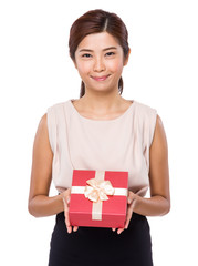 Young woman holding with gift box
