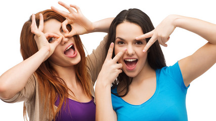 two young teenagers making faces
