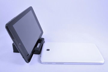 one tablet at support and another is lying near