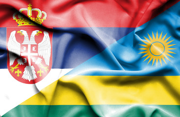 Waving flag of Rwanda and Serbia