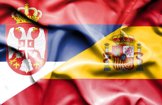 Waving flag of Spain and Serbia