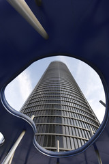 Skyscraper facade view from below through a roof hole