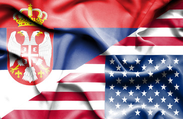 Waving flag of United States of America and Serbia