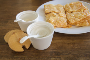 crispy pancake named -roti-,fried bread with butter and egg