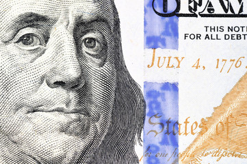Portrait of Benjamin Franklin from one hundred dollars bill new edition macro
