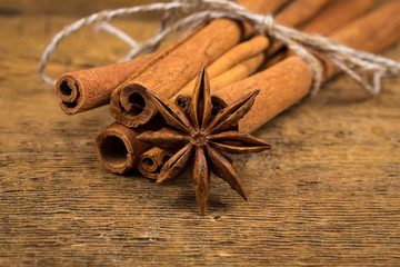 Close up of cinnamon sticks and star anise on wood