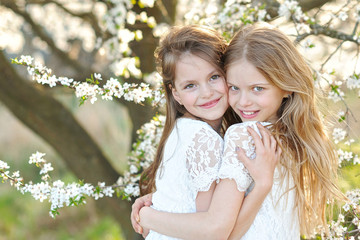 Portrait of two little girls girlfriends spring