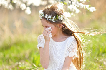 portrait of a beautiful little girl in spring