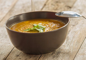 A bowl of spicy pumpkin soup