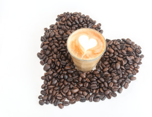 Hot coffee with heart inside on heart shape coffee beans
