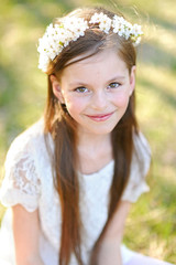 portrait of a beautiful little girl in spring