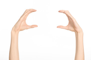 Hand gestures theme: the human hand shows gestures isolated on white background in studio