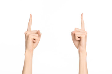 Hand gestures theme: the human hand shows gestures isolated on white background in studio