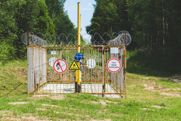 gas main. Signs translation: Attention Gas! Entrance Forbidden!