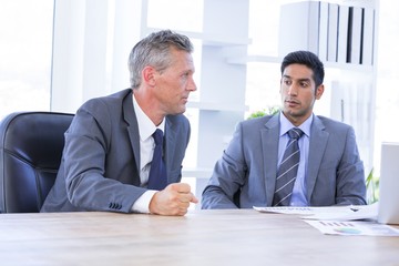  Businessman meeting withcolleague using laptop