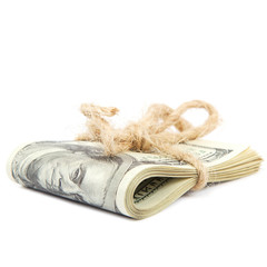 Roll of dollar banknotes on white background.