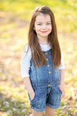 portrait of little girl outdoors in summer