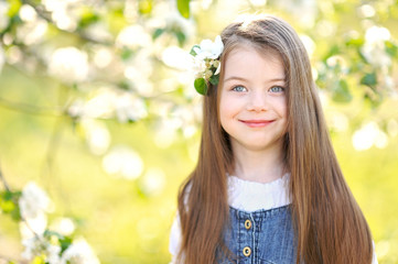 portrait of little girl outdoors in summer