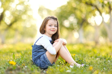 Naklejka na ściany i meble portrait of little girl outdoors in summer