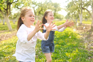 Fototapeta premium Portrait of two girls in the woods girlfriends