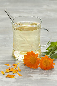 Glass with pot marigold tea