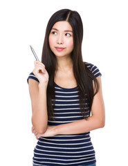 Young woman think of the idea with holding a pen