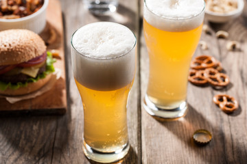 Light beer with a Burger and snacks