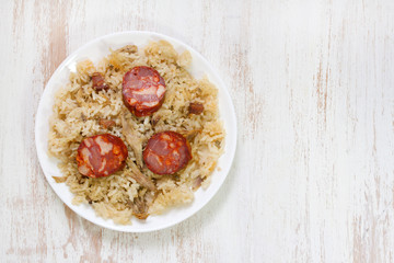 portuguese dish duck rice on white plate