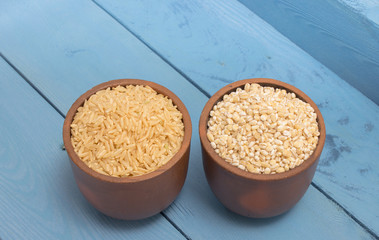 buckwheat groats and rice on the blue board