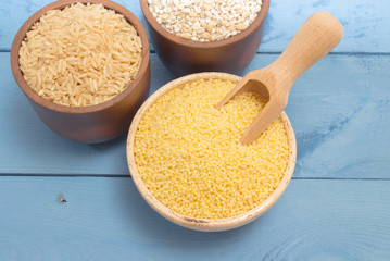 millet and buckwheat groats, rice on the blue board