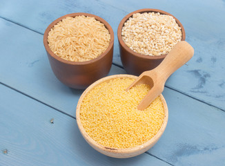 millet and buckwheat groats, rice on the blue board