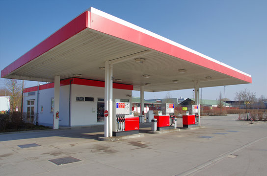 Car petrol gas station. Empty gas station with red roof and pumps.