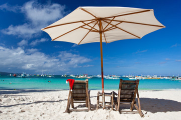 Sun umbrella with Santa Claus Hat on chair longue