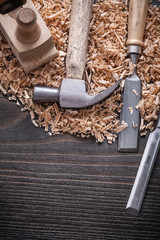 Vertical view of claw hammer chisels wooden shaving plane and pl