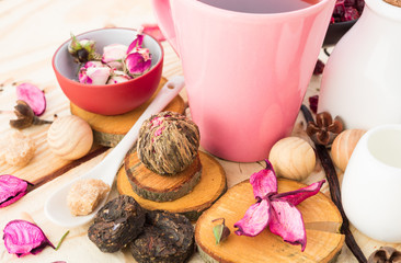 Tea cups with teapot on old wooden table